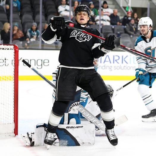 Alex Turcotte tries to avoid a collision with Barracuda's goalie Strauss Mann