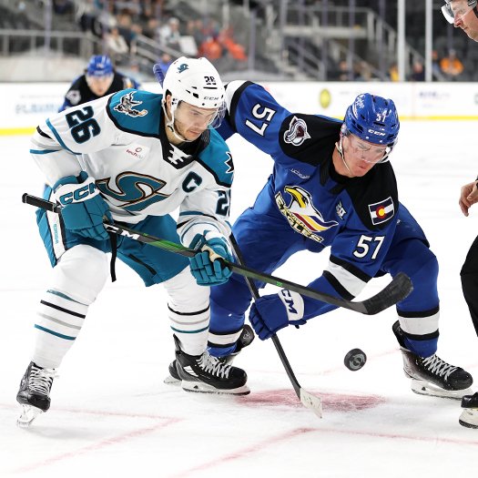 Andrew Agozzino (26) and Mikhail Maltsev (57) look to control the puck after a faceoff