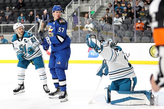 Barracuda's goalie Eetu Makiniemi makes glove save as Andrew Agozzino (26) and Mikhail Maltsev (57) look for a rebound