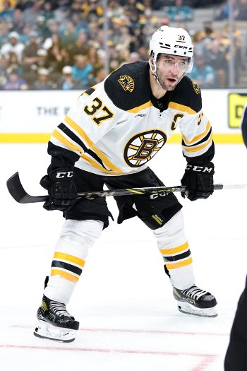 Bruins captain Patrice Bergeron lines up for a face-off