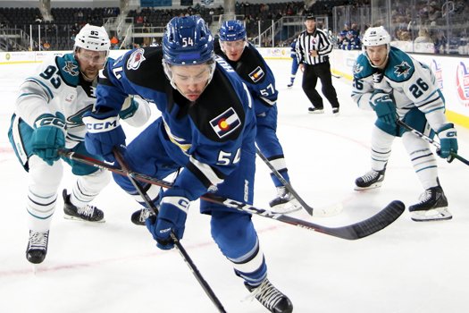 Charles Hudson (54) attempts to control the puck in front of Patrick Sieloff (93)