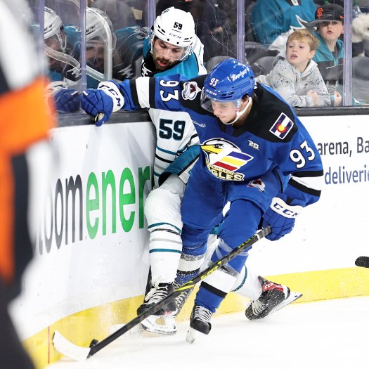 Jean-Luc Foudy (93) checks Nick Cicek (59) off the puck