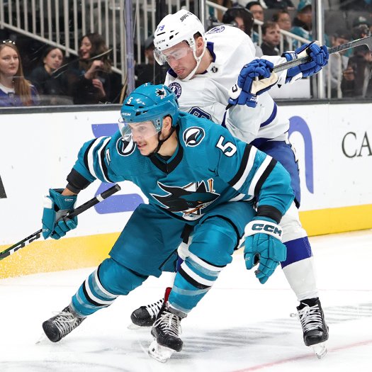Matt Benning (5) and Ross Colton (Right) chase the puck in the corner