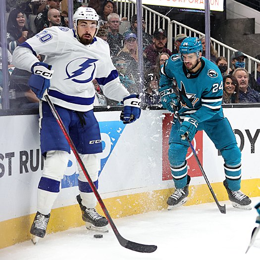 Nicholas Paul (20) looks for the puck as Jaycob Megna (24) moves in