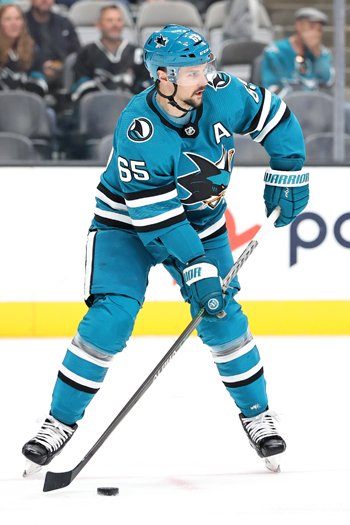 Sharks defenseman Erik Karlsson looks to move the puck up ice