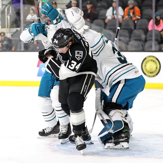 Taylor Ward (34) ducks under a shot in front of Barracuda's goalie Strauss Mann