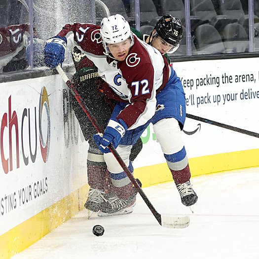 Wyatt Aamodt (72) fights for the puck with Manix Landry (76)