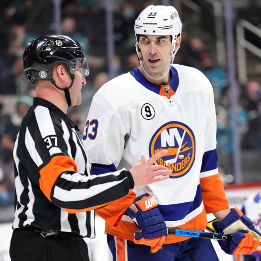 Zdeno Chara talks with referee Pierre Lambert